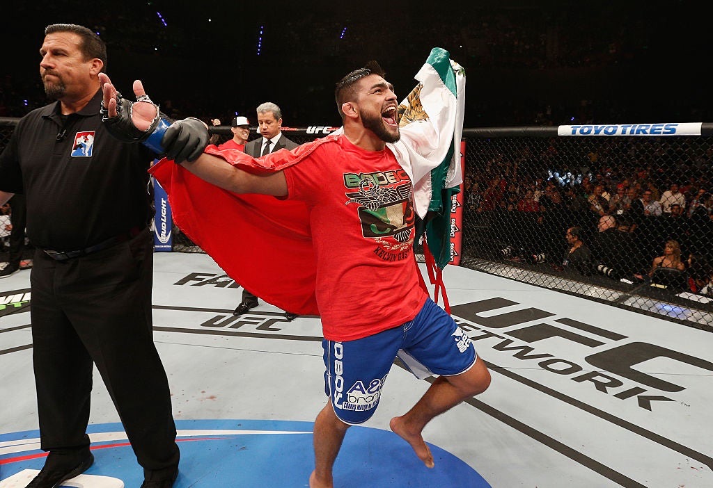 A young Kelvin Gastelum draped in the Mexican flag after a win